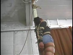 Asian girl gets hogtied and mouth taped shut by her sadistic master