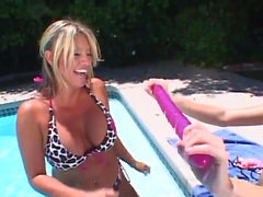 Absolute bombshells playing with a double-sided dildo